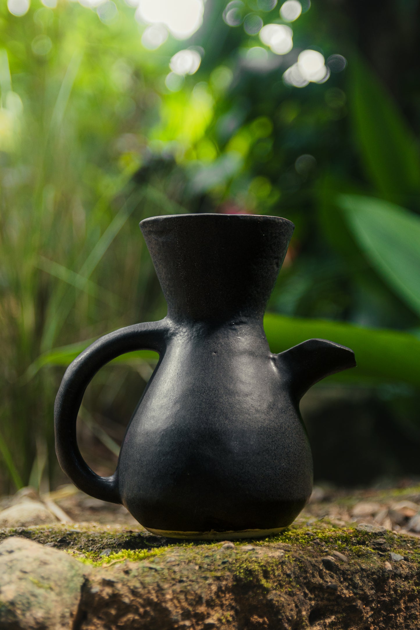 Minimalist black ceramic pour over coffee maker, artisanal coffee brewer from Costa Rica